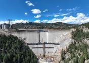 Gross Dam under construction. Scaffolding can be seen where steps are being put in place. 