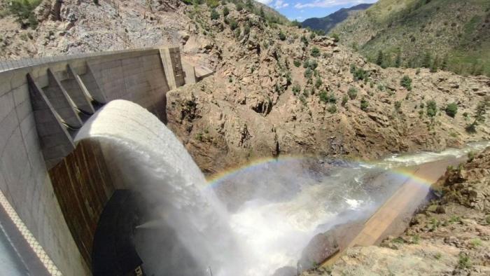 Water rushes off a dam