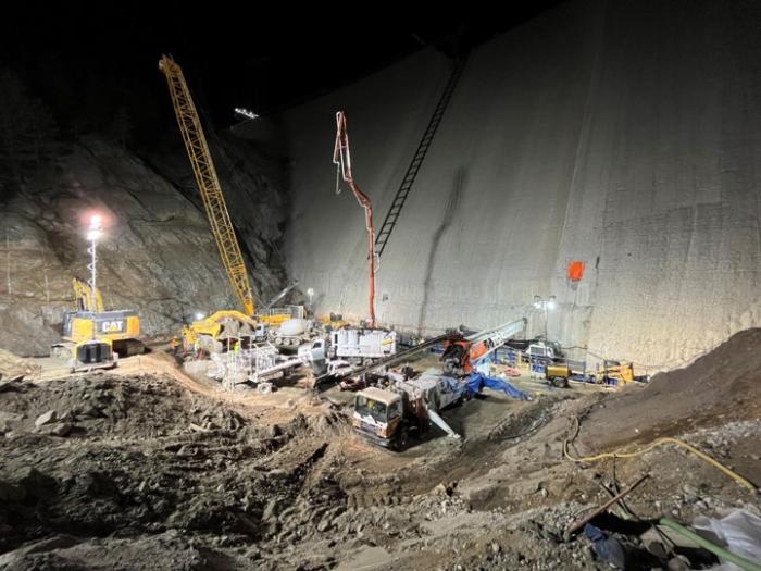 Heavy equipment work on the dam at night