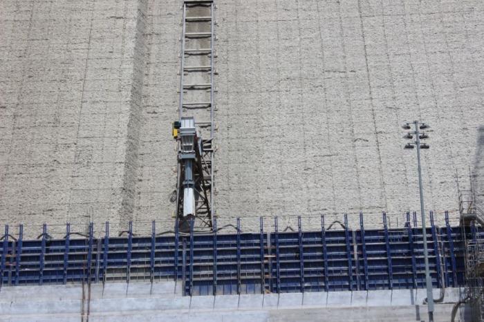 Machine working on the side of Gross Dam