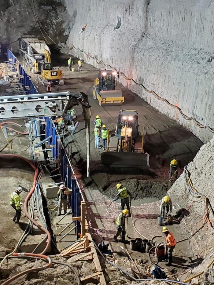 Crews lay concrete at night