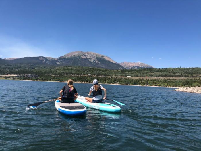 Two paddleboarders on a lake