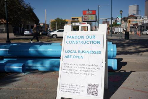 A-frame sign letting people know that businesses are open during construction. 