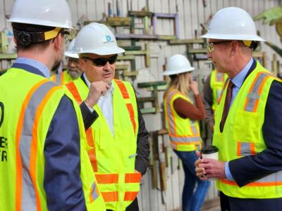 Alan Salazar speaking with EPA in PPE at LRP job site. 