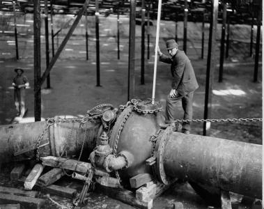 An employee checks on a new pipe in Denver Water’s underground pump station in Capitol Hill on Oct. 11, 1916.
