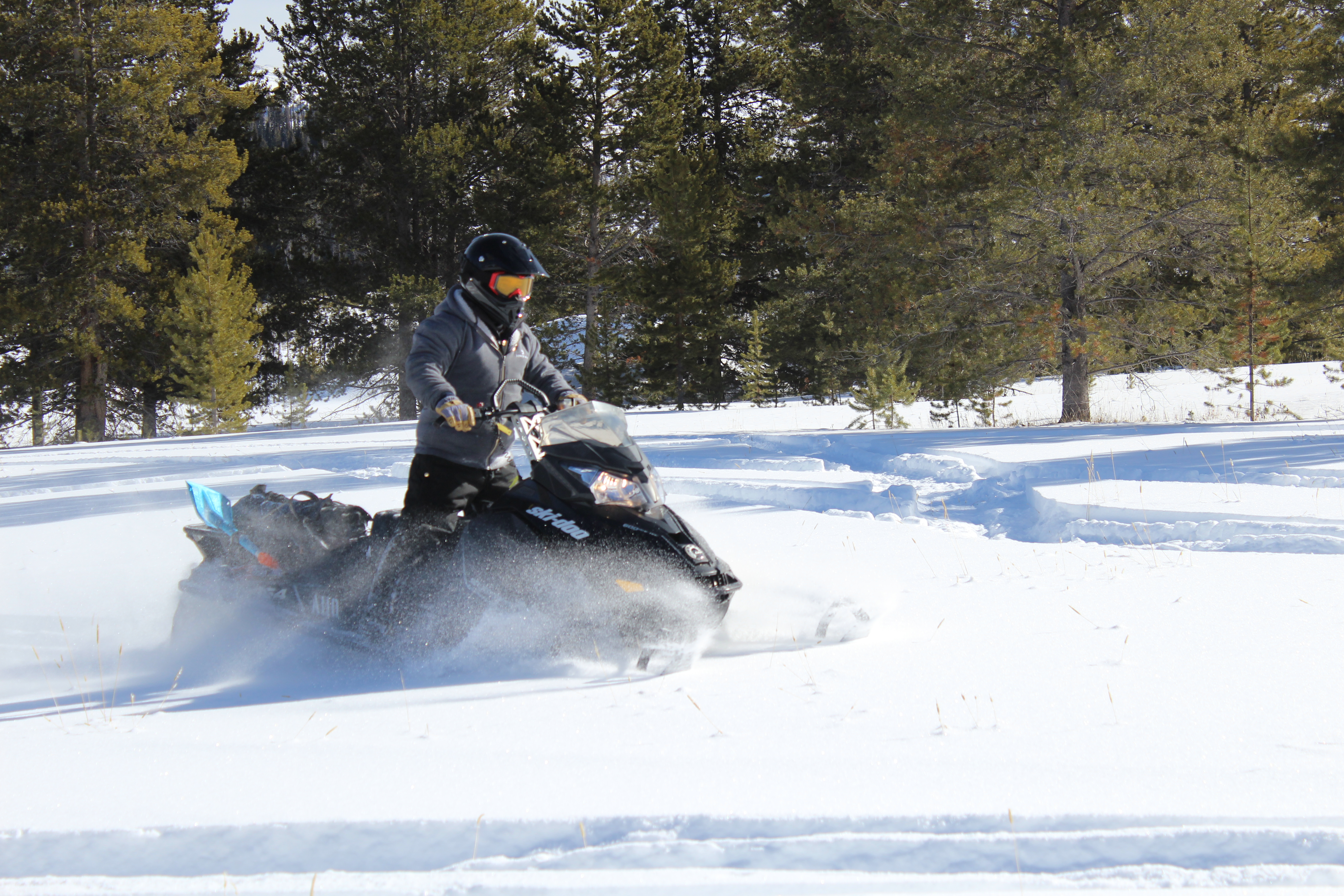 Conor Peters rides snowmobile in Winter Park
